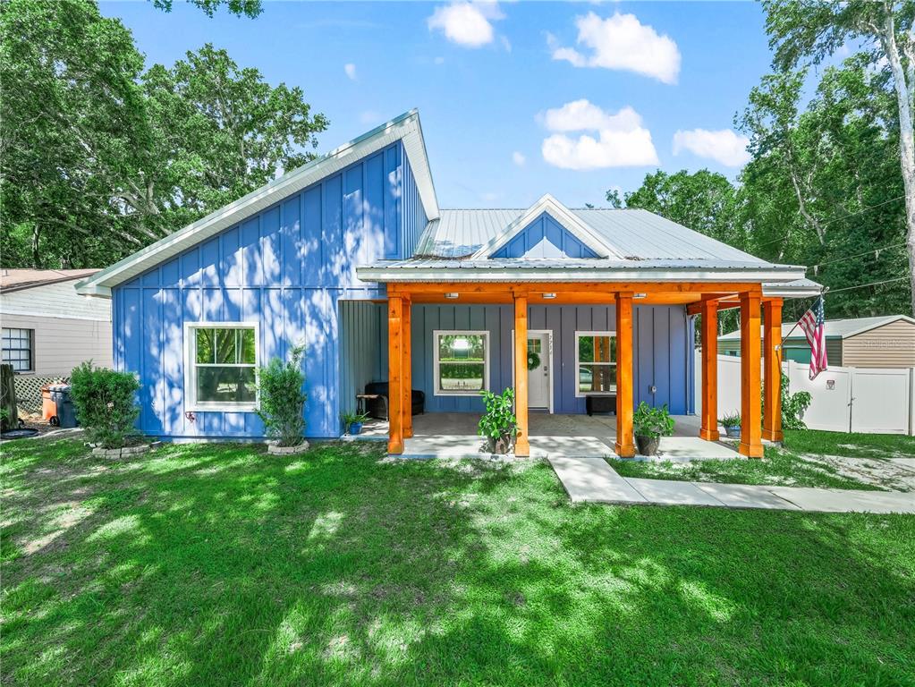 7714 Chase Road Lakeland, FL 33810 - Photo 1 of 1 a view of a house with backyard porch and sitting area