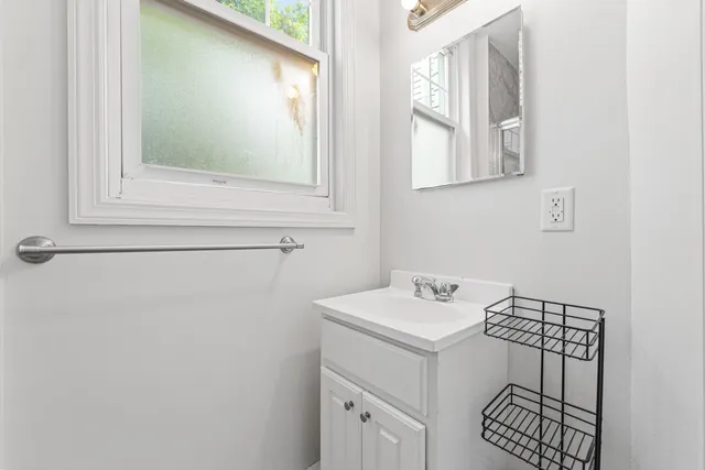 a utility room with a sink dryer and washer