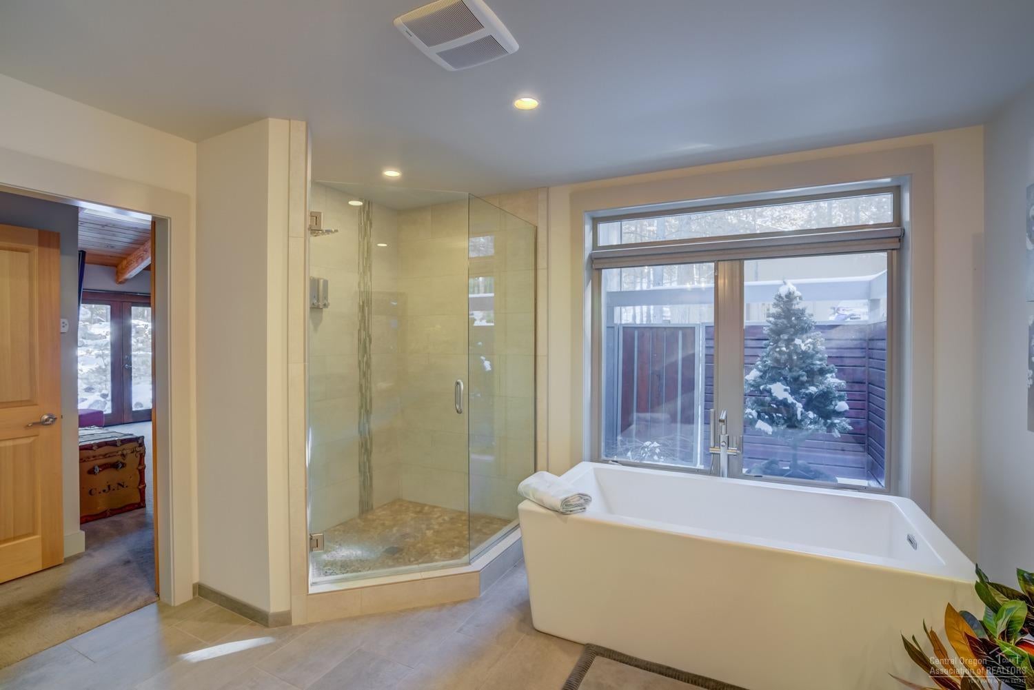 70823 Shepherd Purse Black Butte Ranch, OR 97759 - Photo 13 of 25 Spa tub and floor to ceiling tile shower