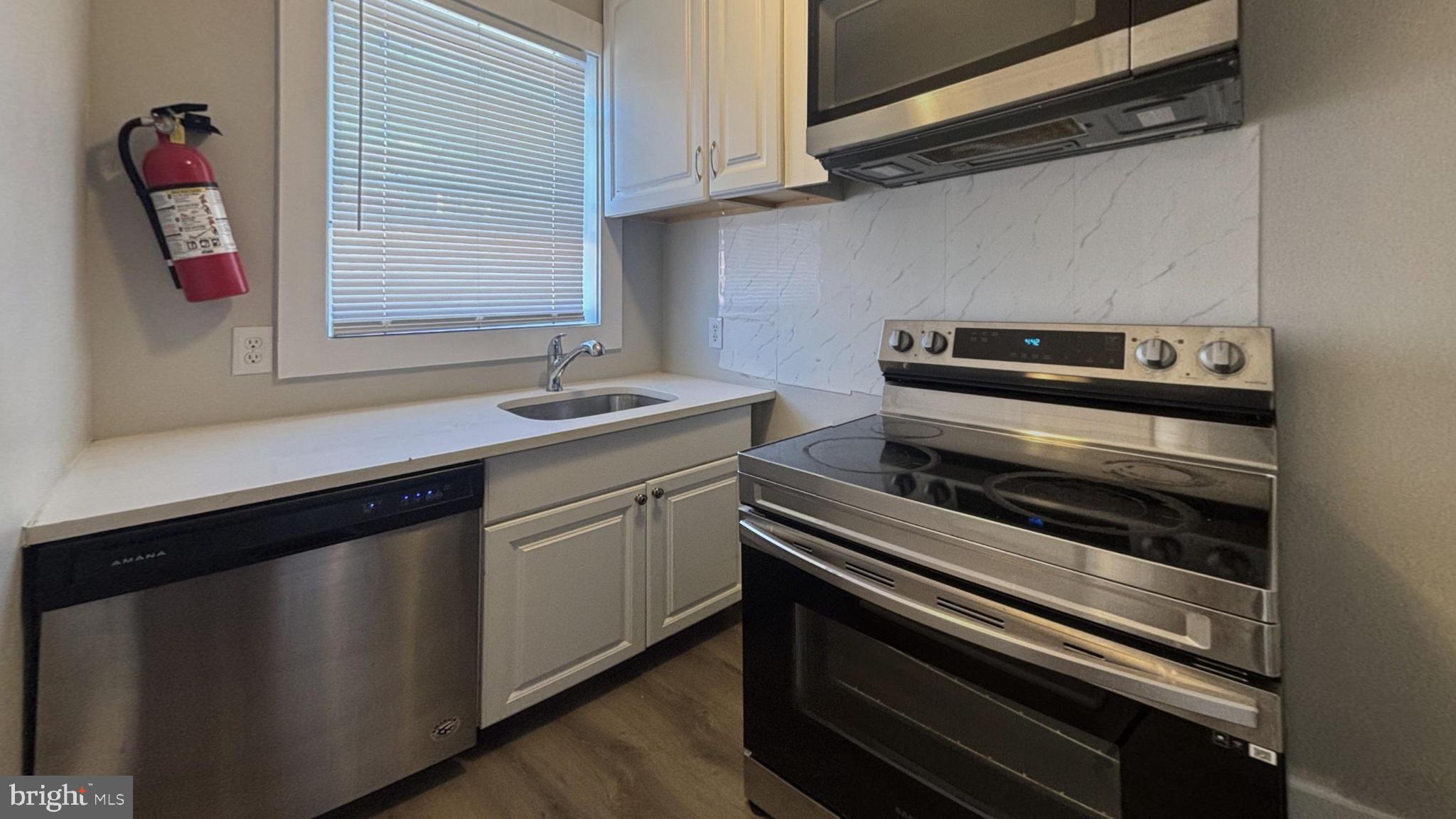 242 Margate Road Upper Darby, PA 19082 - Photo 2 of 9 Modern kitchen with sleek appliances.
