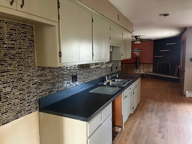 a kitchen that has a sink and a stove