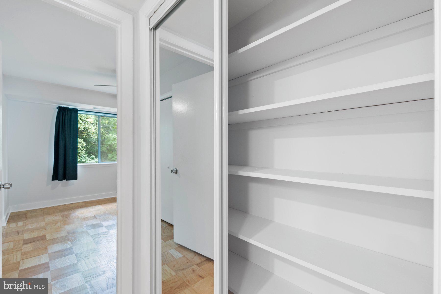 11609 Vantage Hill Road, Unit 12B Reston, VA 20190 - Photo 21 of 39 Hallway Closet - View into Bedroom #2