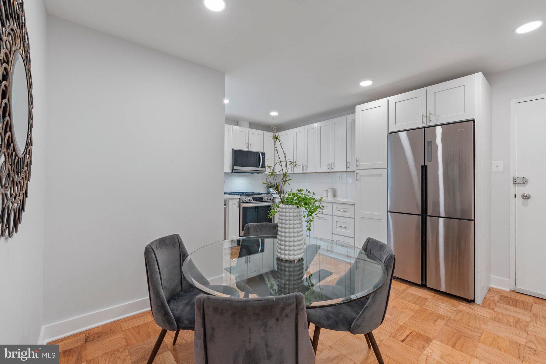 11609 Vantage Hill Road, Unit 12B Reston, VA 20190 - Photo 5 of 39 Dining Room View to Front Entry