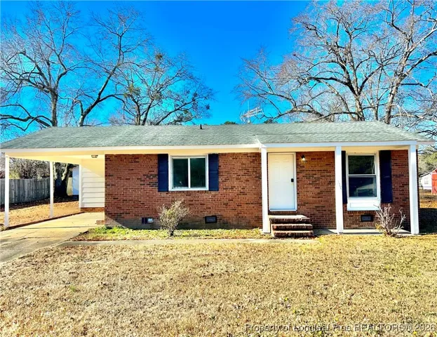front view of a house with a yard