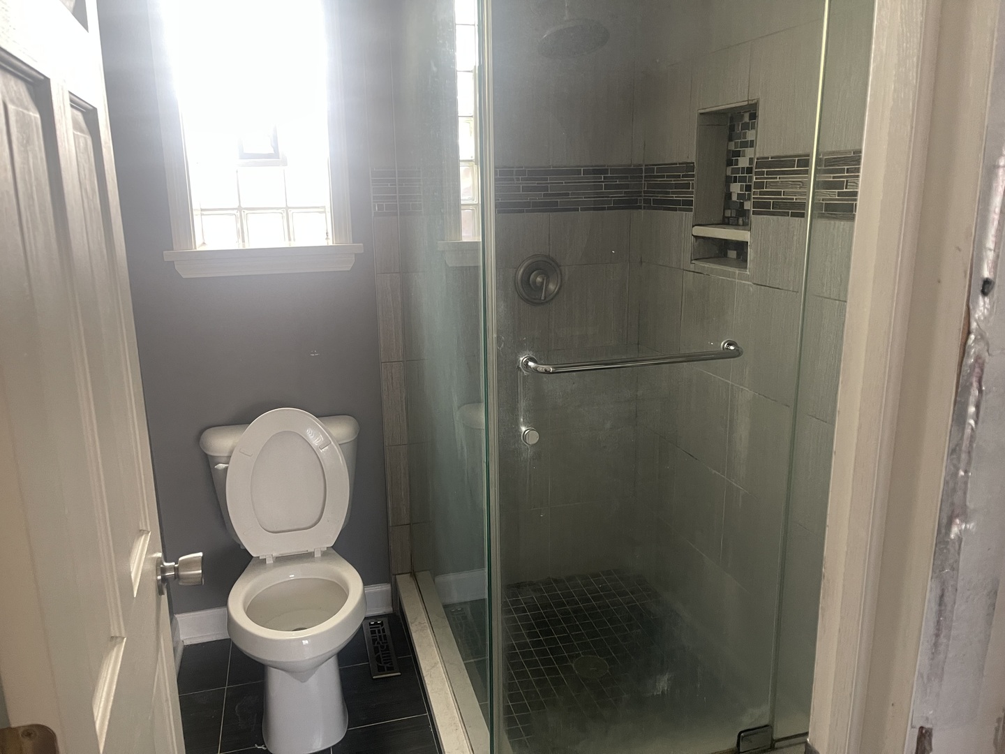 2213 South Oakley Avenue Chicago, IL 60608 - Photo 15 of 27 a bathroom with a toilet and a shower
