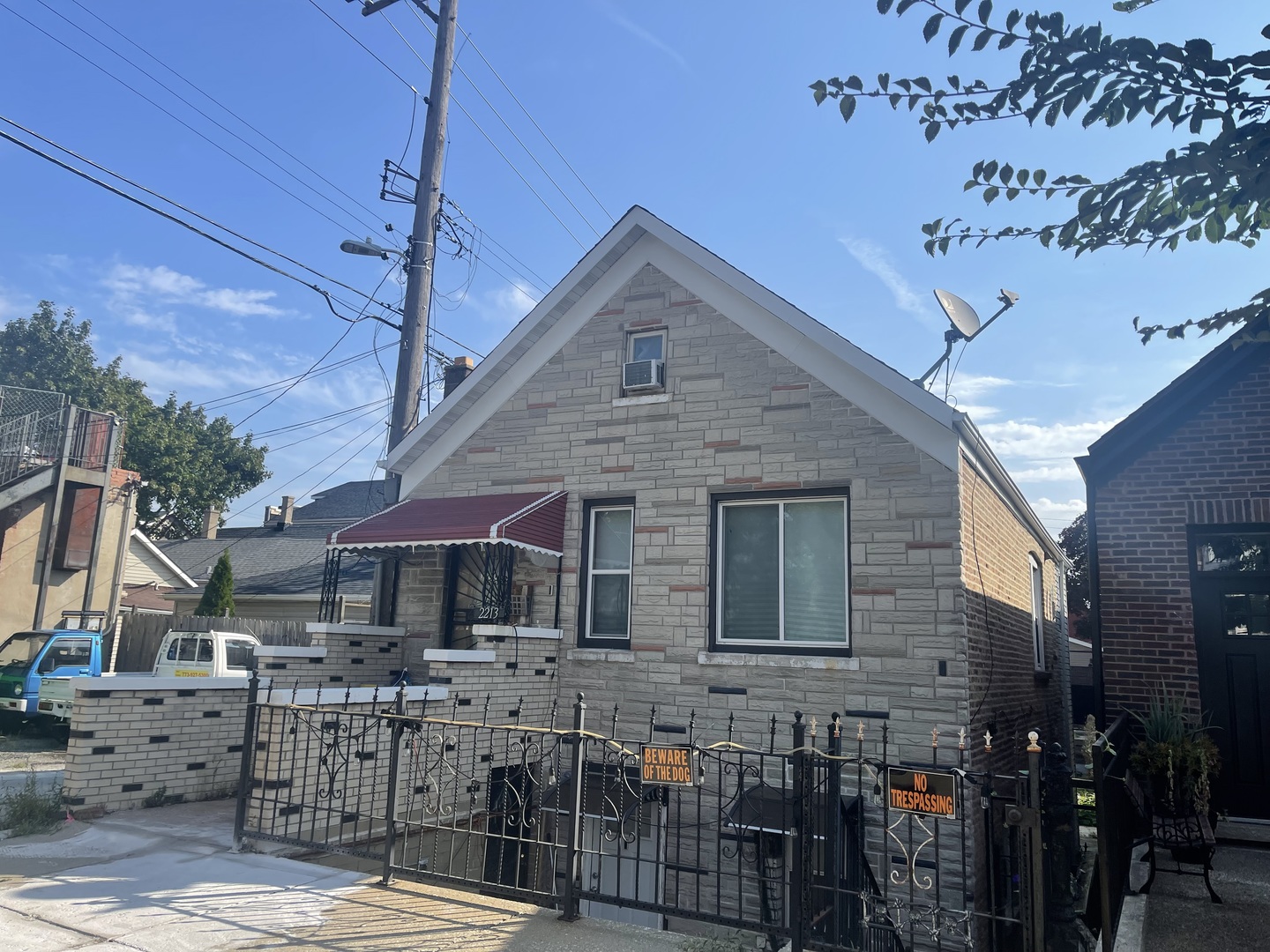 2213 South Oakley Avenue Chicago, IL 60608 - Photo 2 of 27 a front view of house with yard outdoor seating and garage