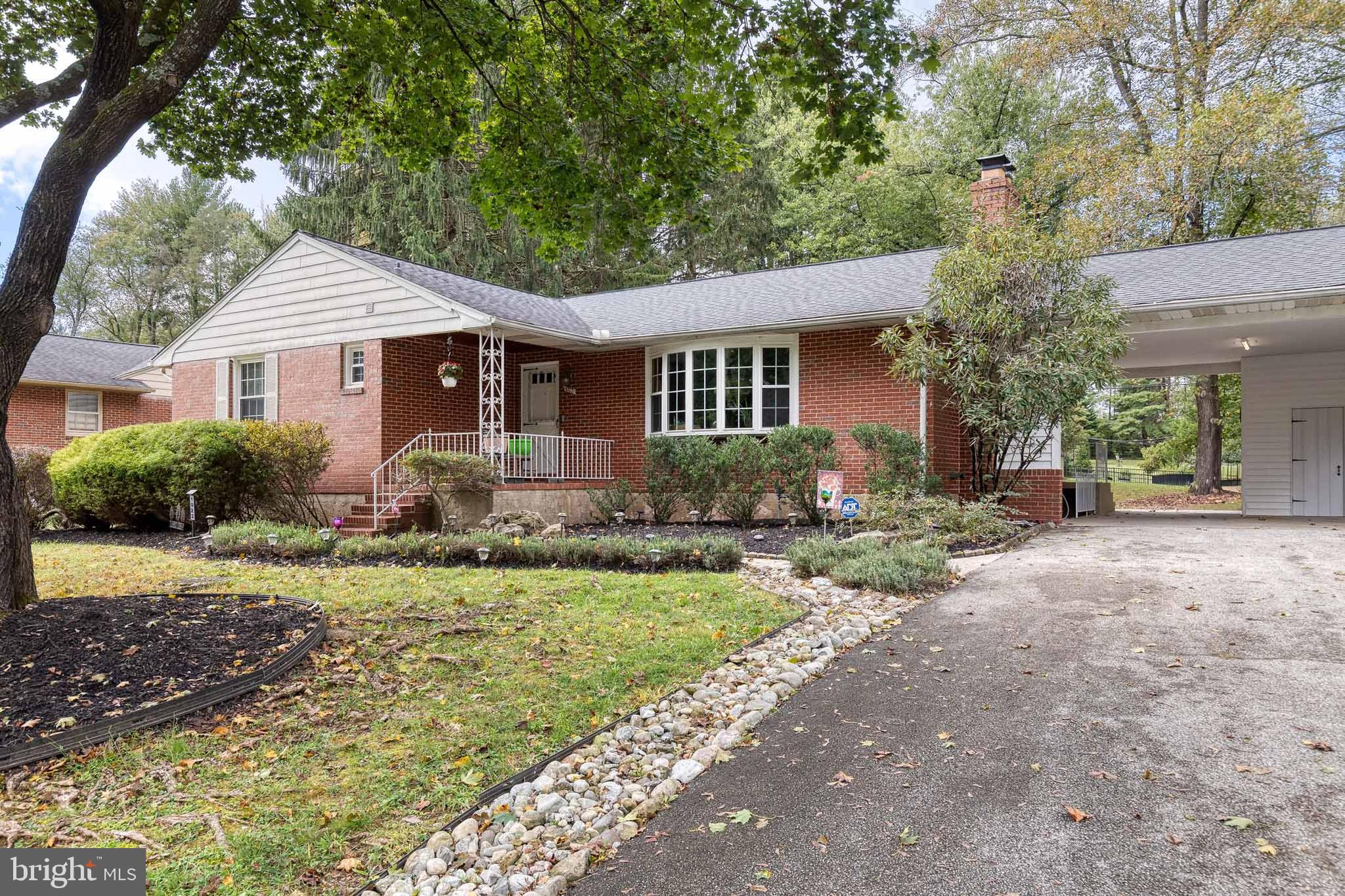 1022 Roxleigh Road Towson, MD 21286 - Photo 1 of 36 a front view of house with yard and green space