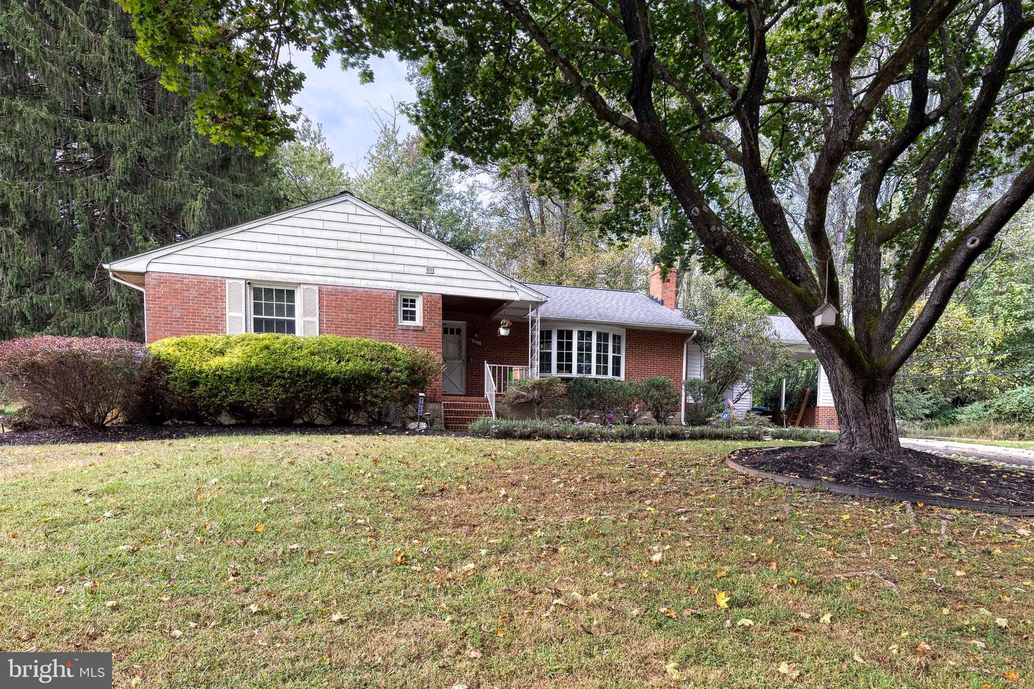 1022 Roxleigh Road Towson, MD 21286 - Photo 2 of 36 a front view of a house with a garden