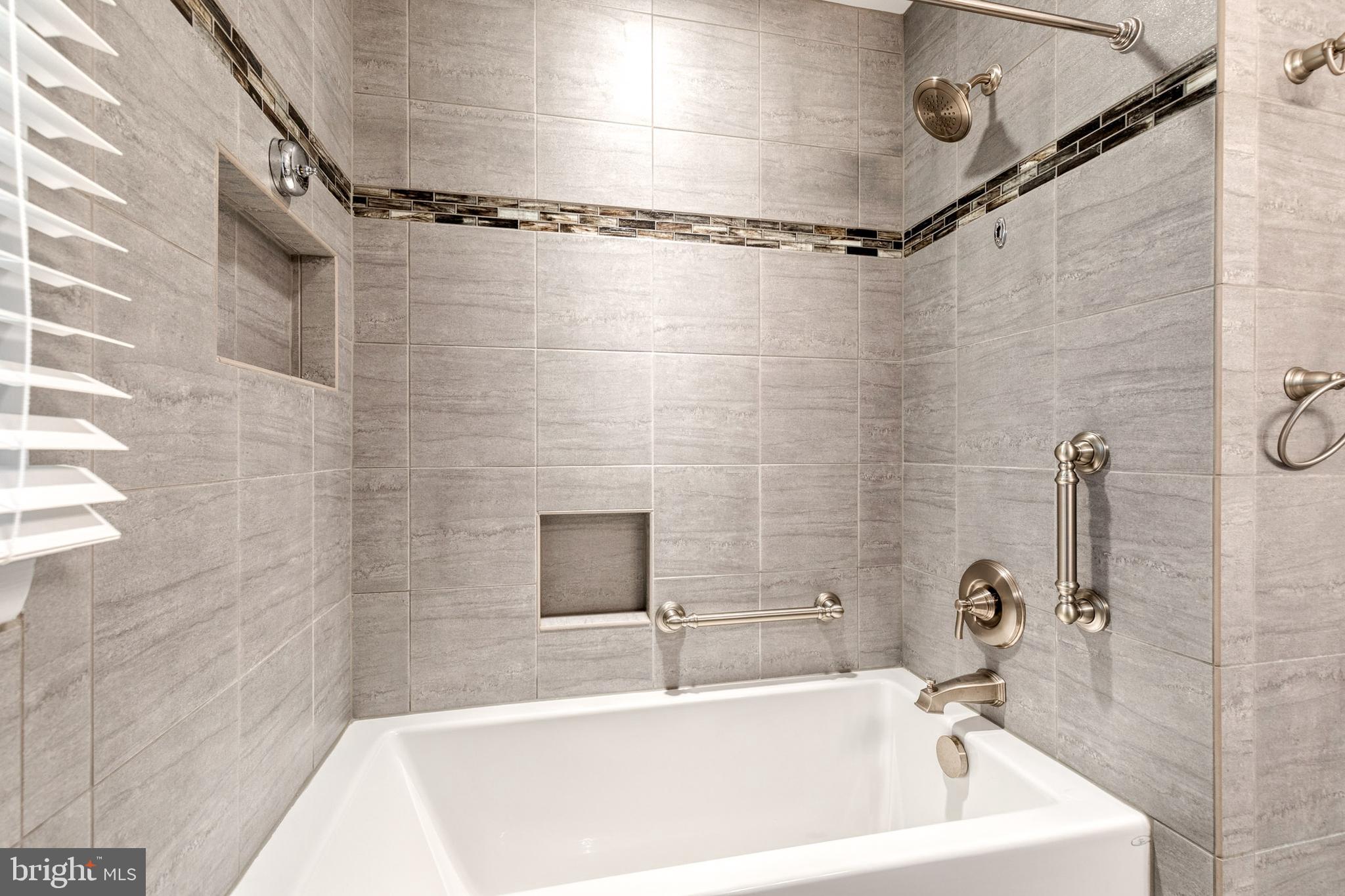 1022 Roxleigh Road Towson, MD 21286 - Photo 24 of 36 a bathroom with a sink a shower and a bathtub