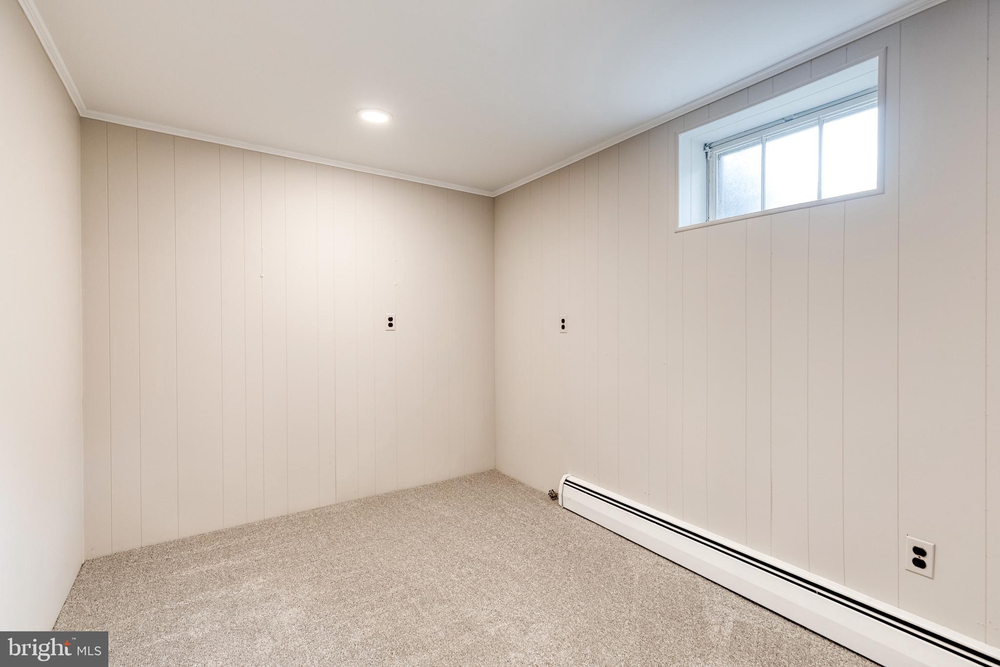 1022 Roxleigh Road Towson, MD 21286 - Photo 27 of 36 an empty room with a workbench