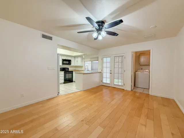 a view of a kitchen with microwave and cabinets
