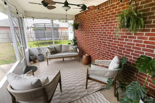 a outdoor living space with furniture and a potted plant