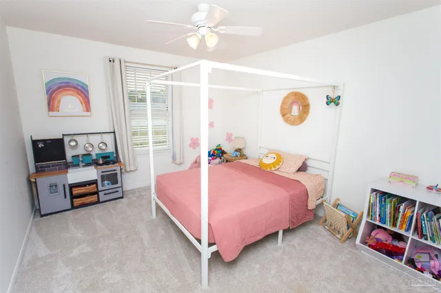 a bedroom with a bed and dresser