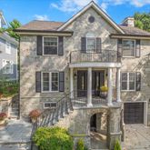 a front view of a house with yard
