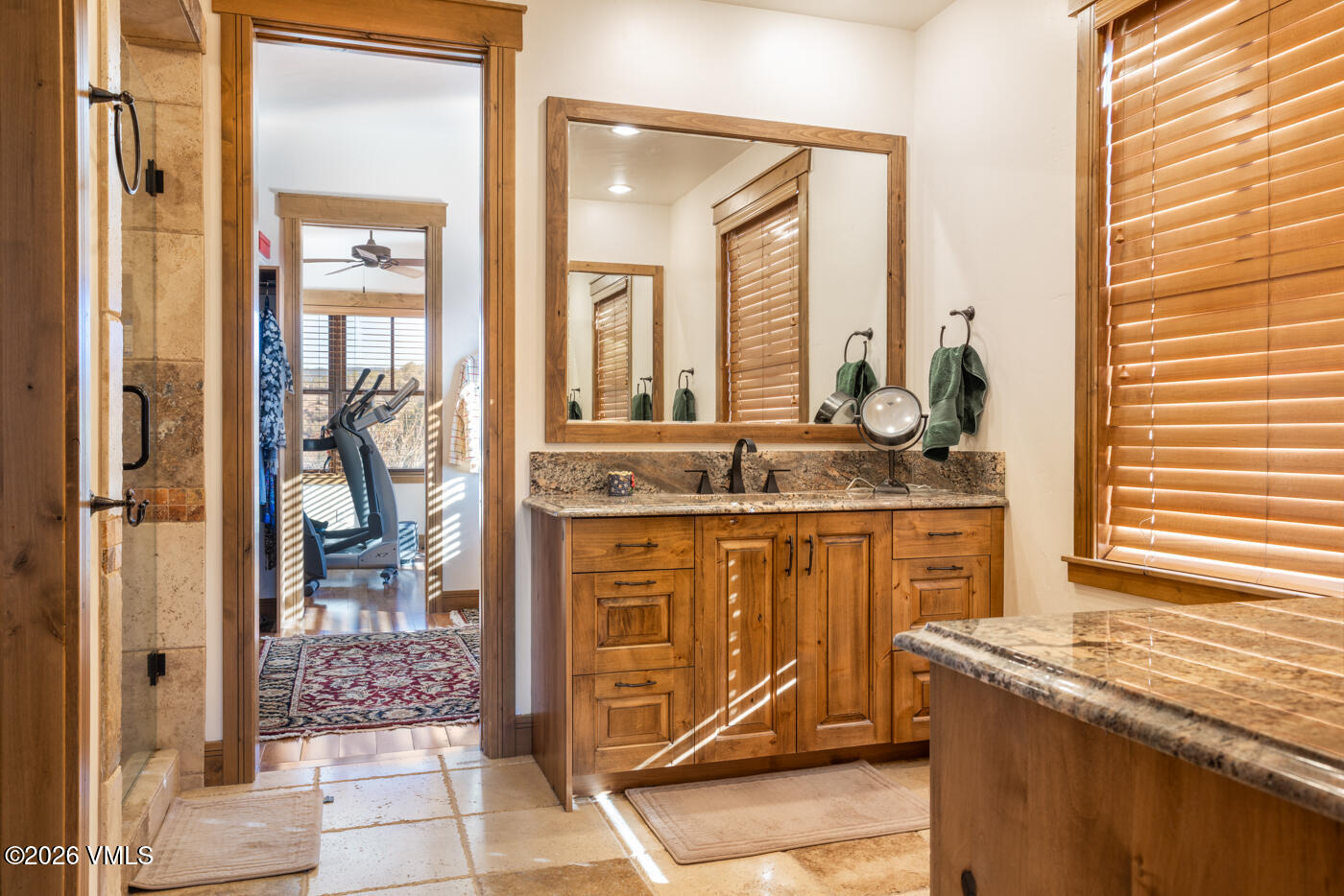 34900 Colorado River Road McCoy, CO 80463 - Photo 23 of 46 a bathroom with a granite countertop sink and a mirror