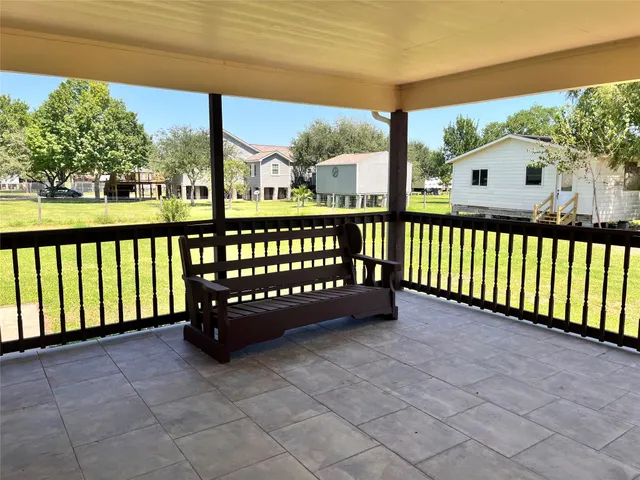 a view of a bench in the porch