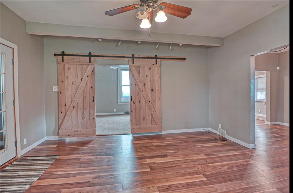 805 Greenhill Road Pittsburgh, PA 15209 - Photo 4 of 17 living room with barn doors into family room