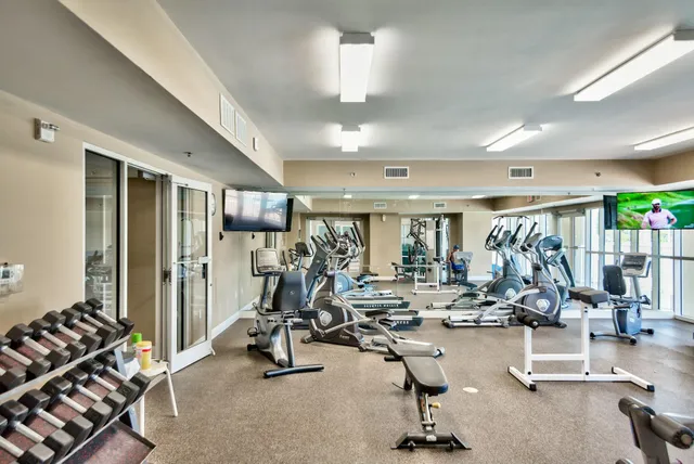 a view of a swimming pool with outdoor seating