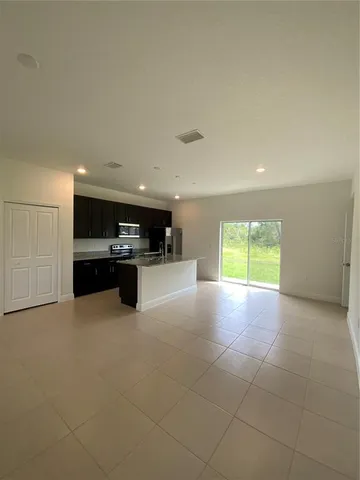a view of kitchen and kitchen with furniture