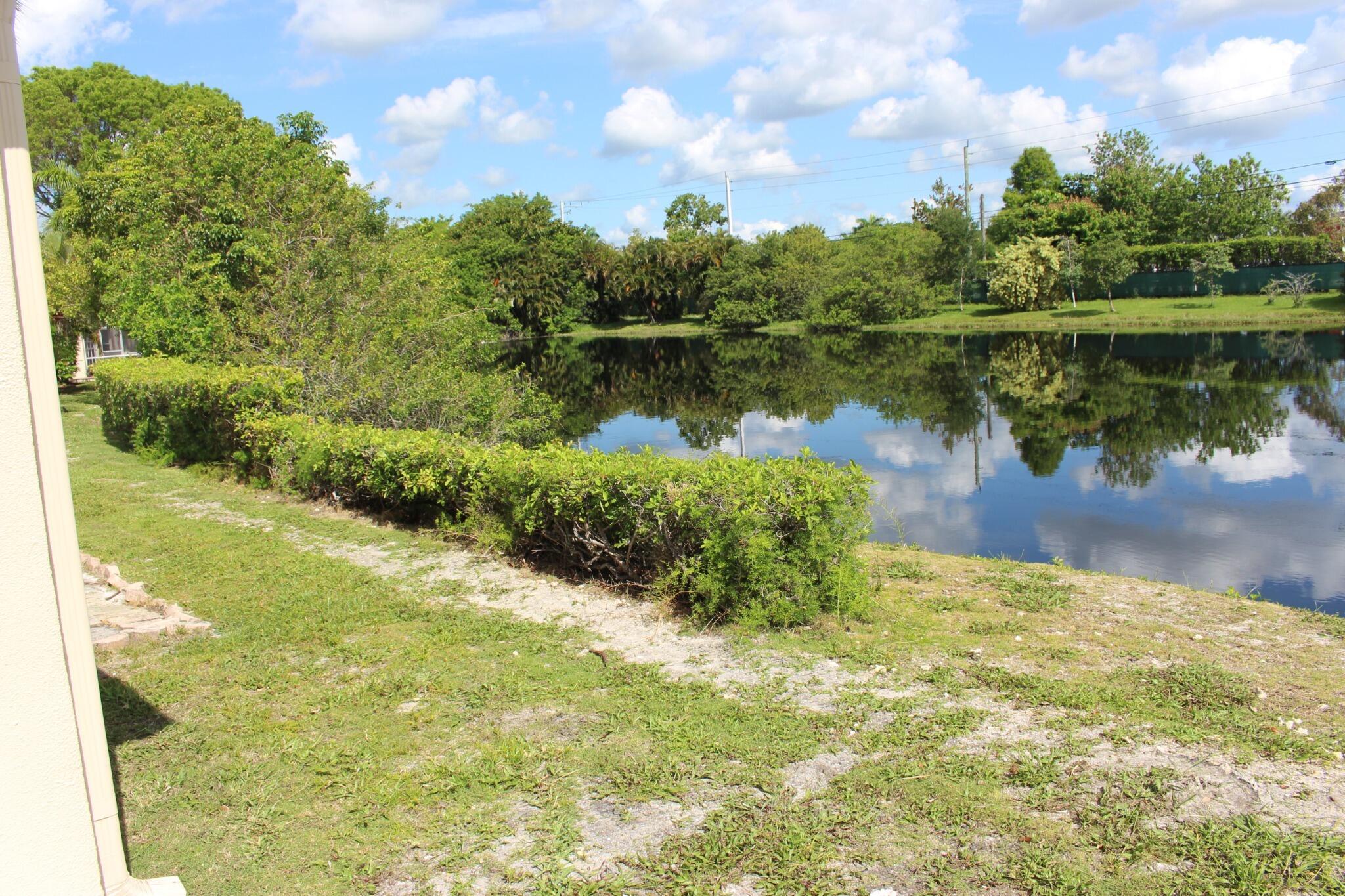 8861 Bella Vista Drive Boca Raton, FL 33433 - Photo 16 of 16 a view of a lake from a yard