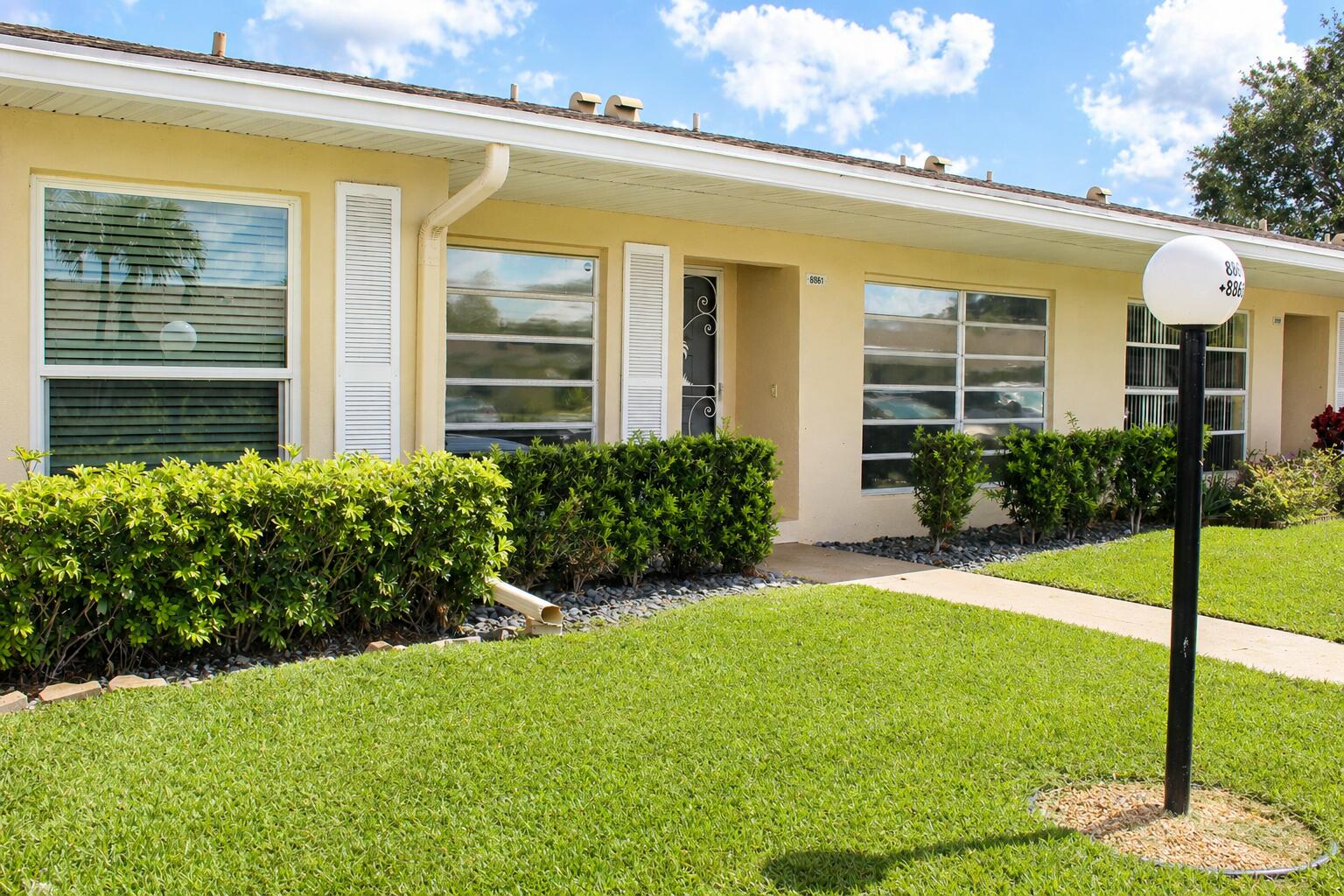 8861 Bella Vista Drive Boca Raton, FL 33433 - Photo 3 of 16 a view of a house with backyard and garden