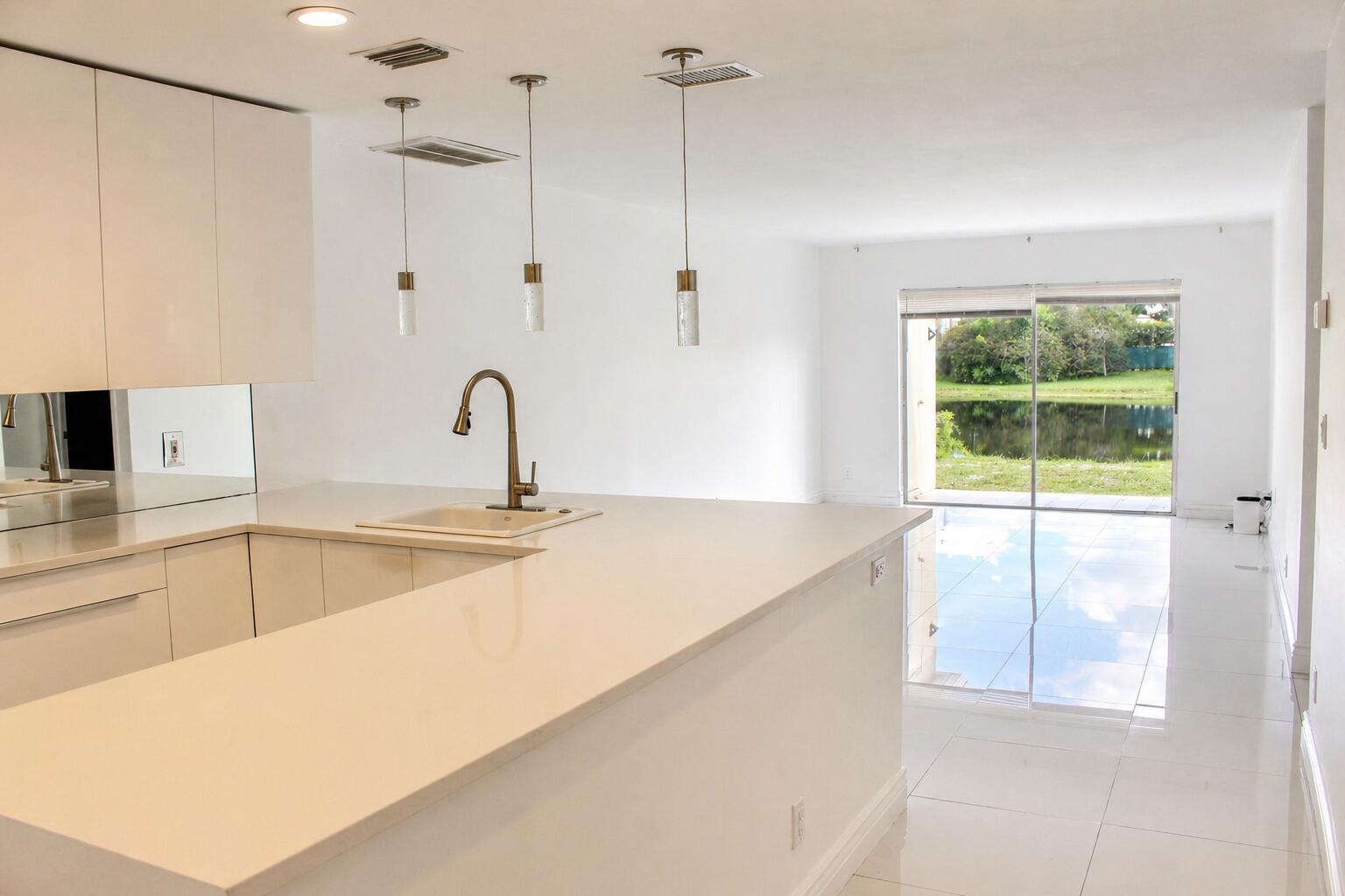 8861 Bella Vista Drive Boca Raton, FL 33433 - Photo 4 of 16 a kitchen with a sink and a window