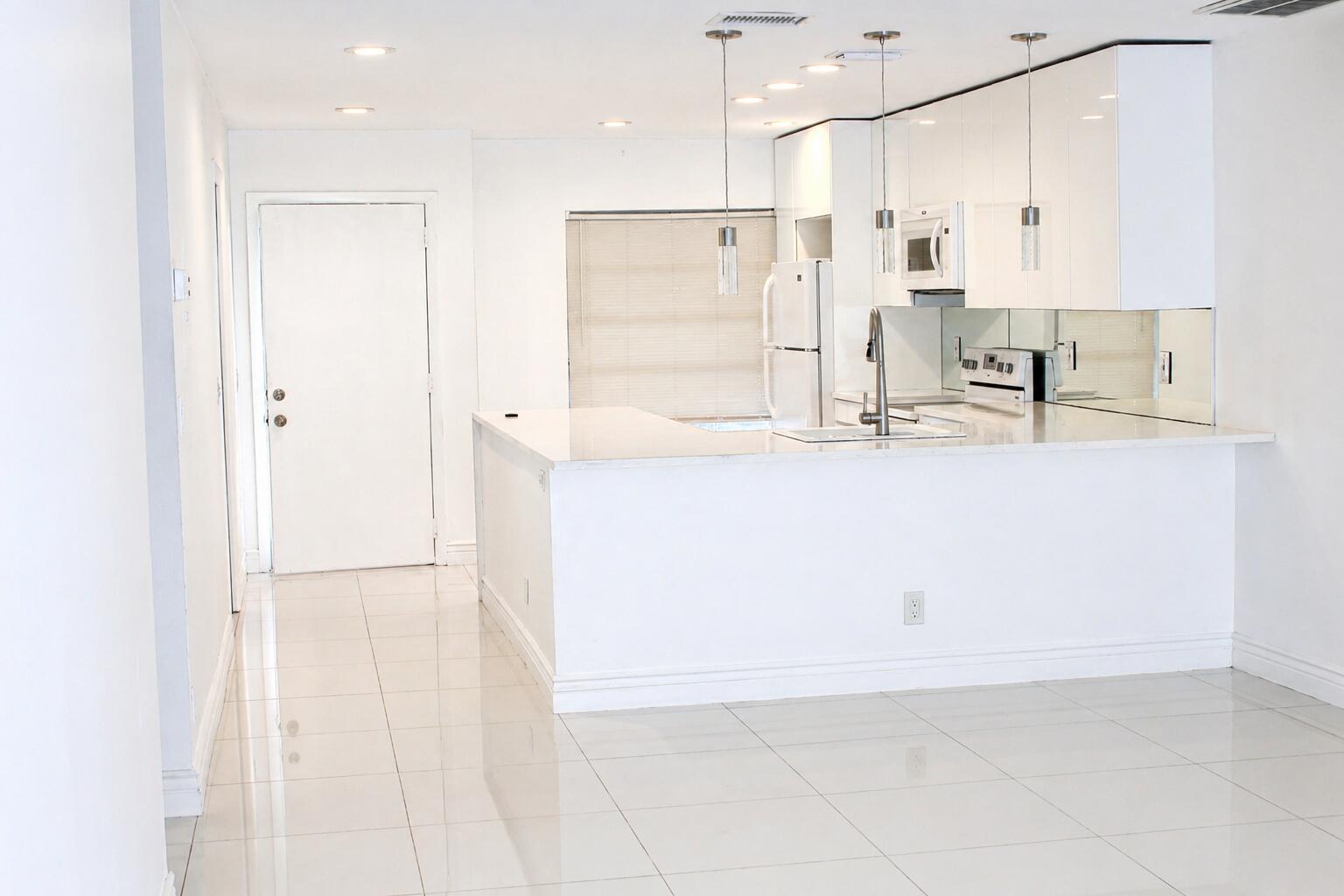 8861 Bella Vista Drive Boca Raton, FL 33433 - Photo 5 of 16 a view of kitchen with wooden floor