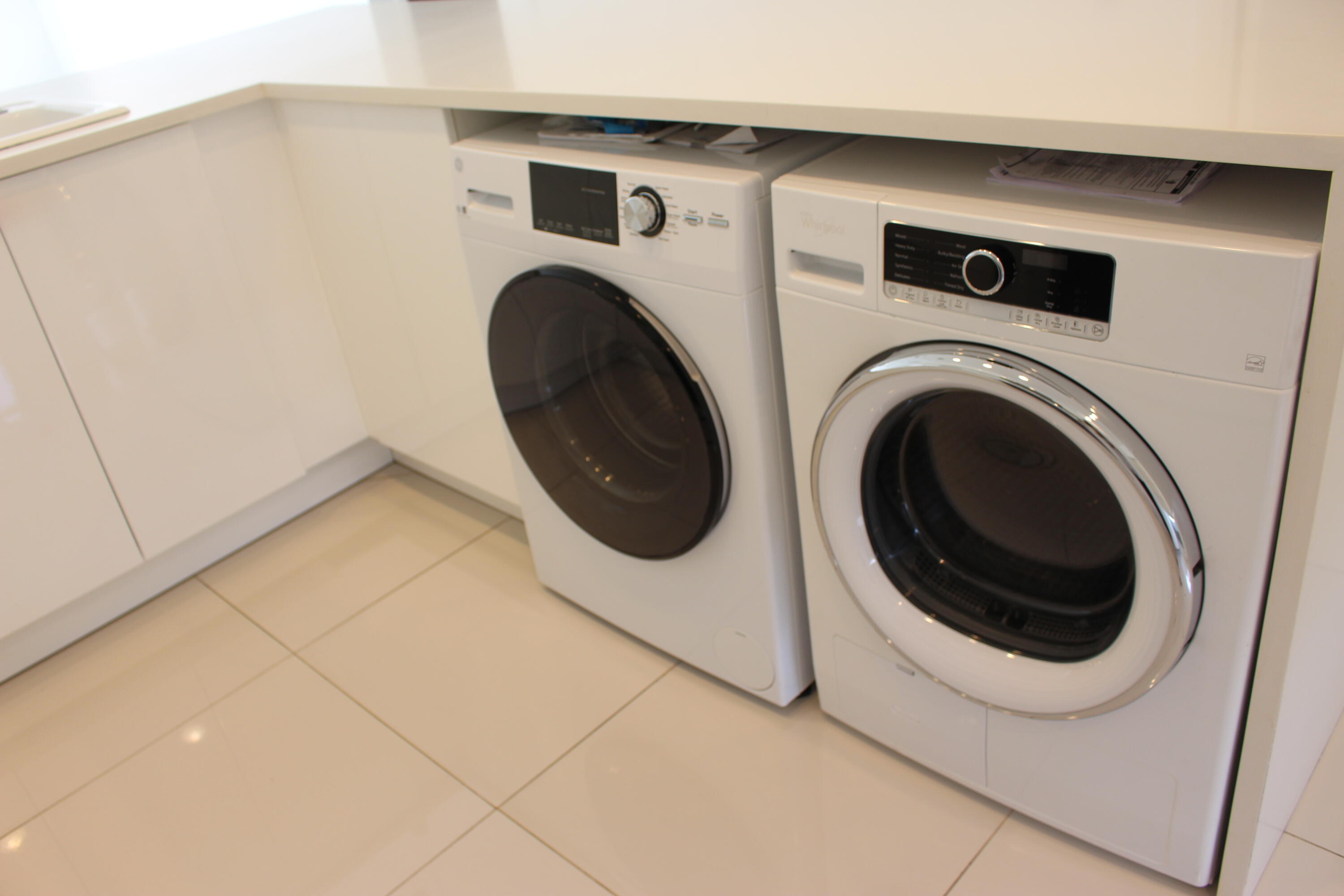 8861 Bella Vista Drive Boca Raton, FL 33433 - Photo 7 of 16 a utility room with dryer and washer