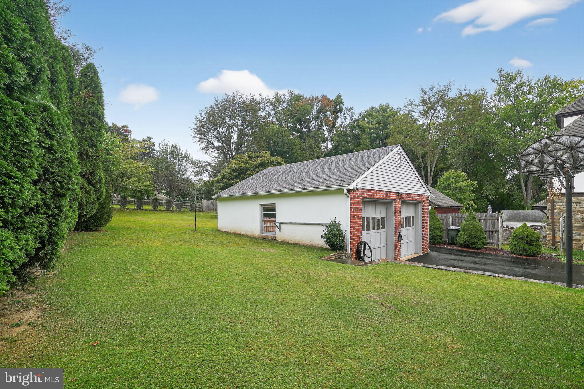 719 Pine Ridge Road Media, PA 19063 - Photo 25 of 29 a view of a house with backyard and trees
