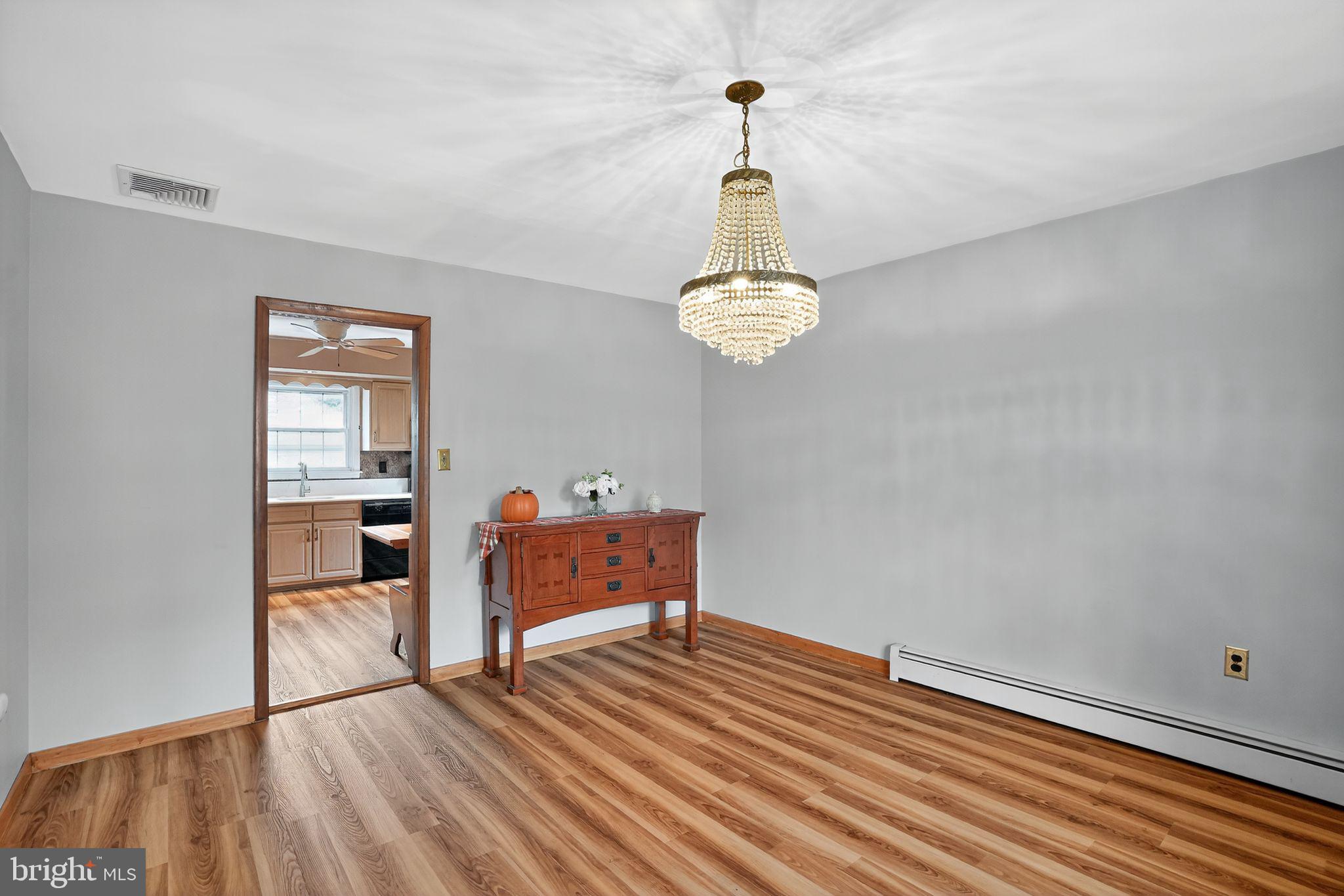 719 Pine Ridge Road Media, PA 19063 - Photo 5 of 29 a view of empty room with wooden floor and window