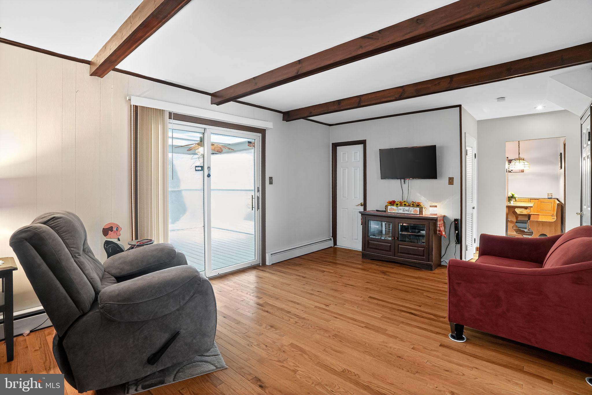 719 Pine Ridge Road Media, PA 19063 - Photo 7 of 29 a living room with furniture and a wooden floor