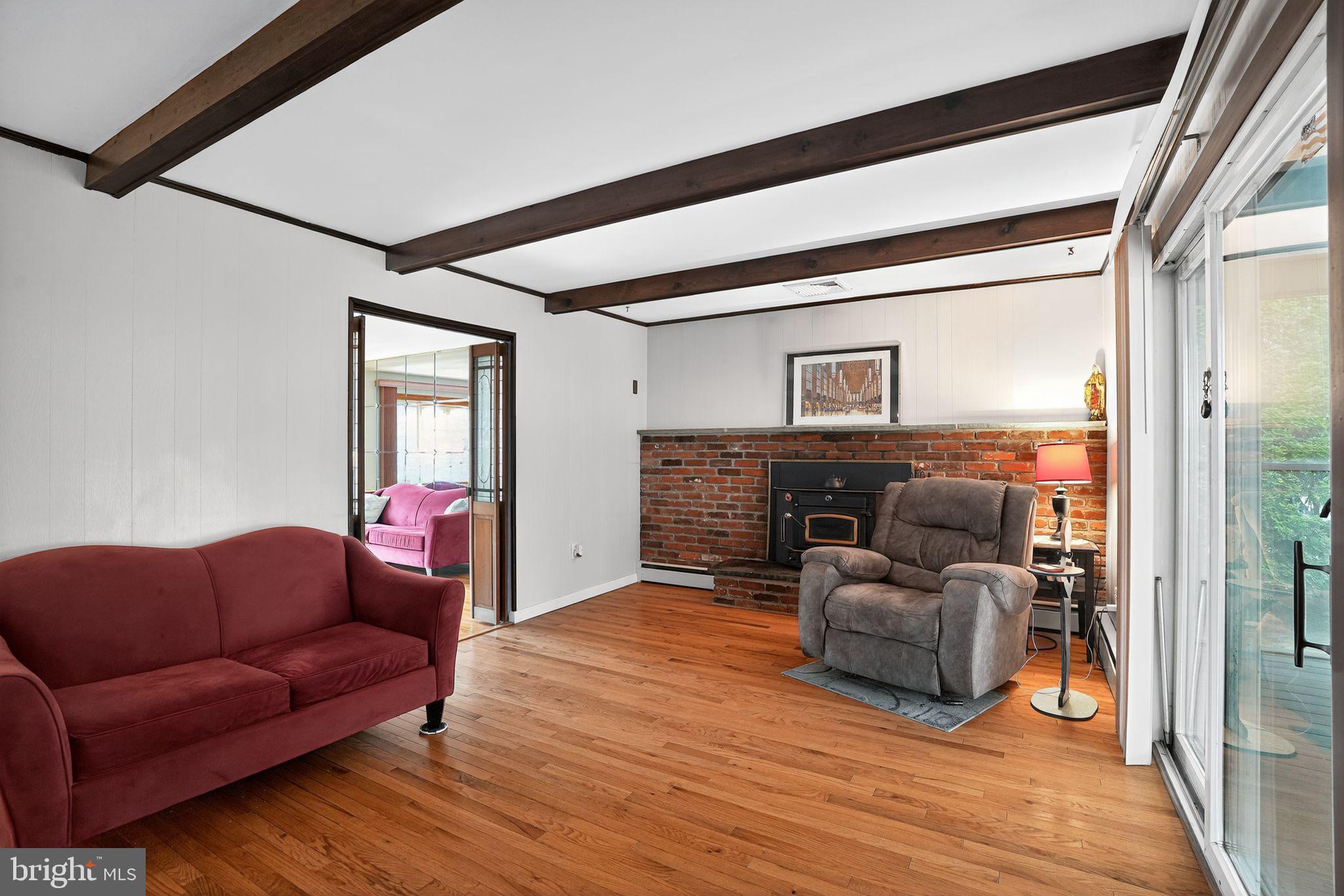 719 Pine Ridge Road Media, PA 19063 - Photo 8 of 29 a living room with furniture and a fireplace
