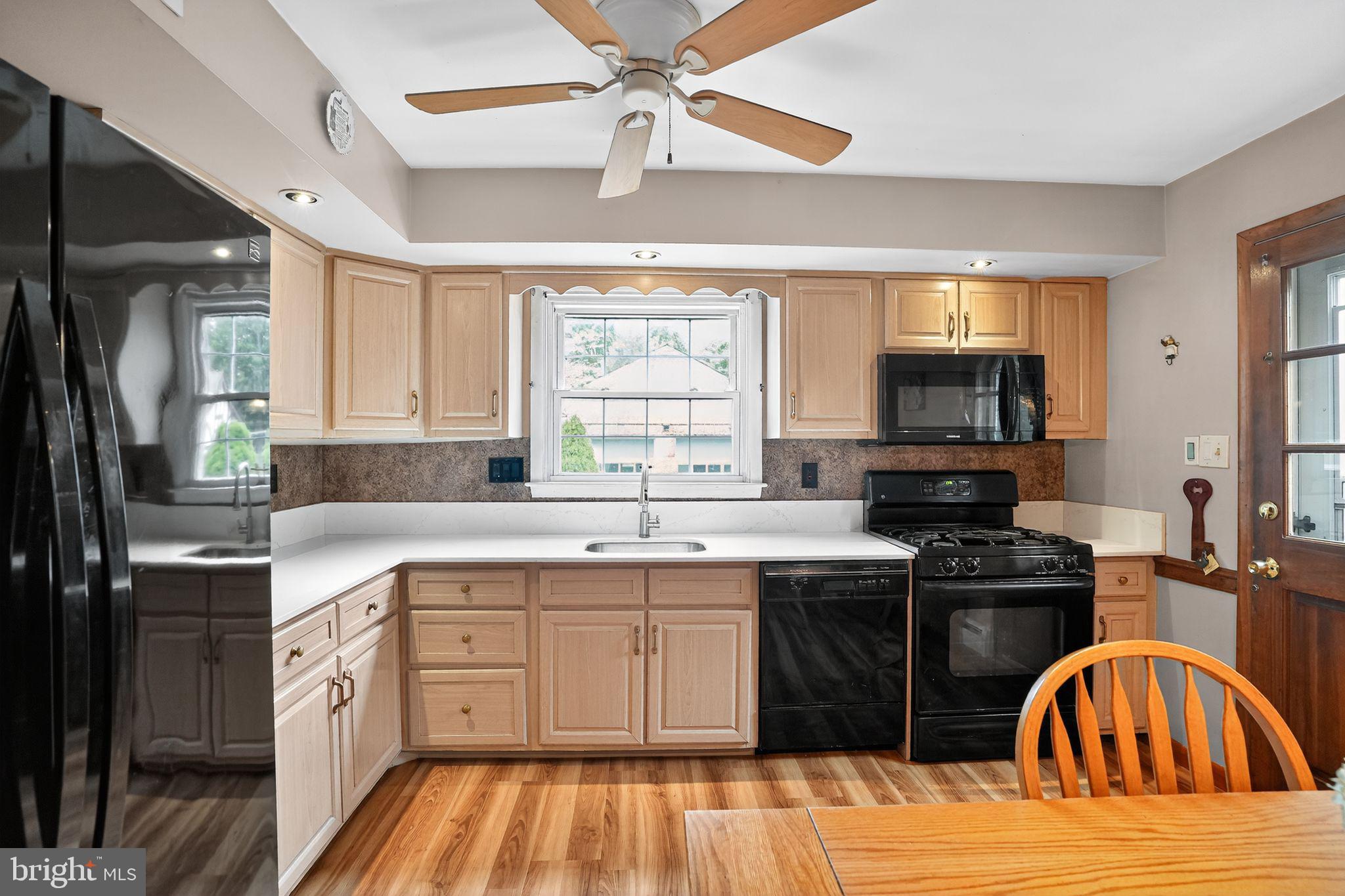 719 Pine Ridge Road Media, PA 19063 - Photo 10 of 29 a kitchen with a sink stove top oven and refrigerator