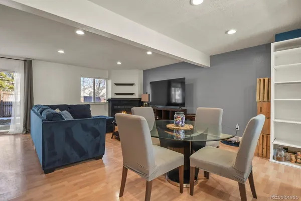 a view of a dining room with furniture and wooden floor