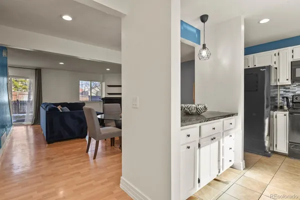 a kitchen with stainless steel appliances granite countertop a stove sink and cabinets