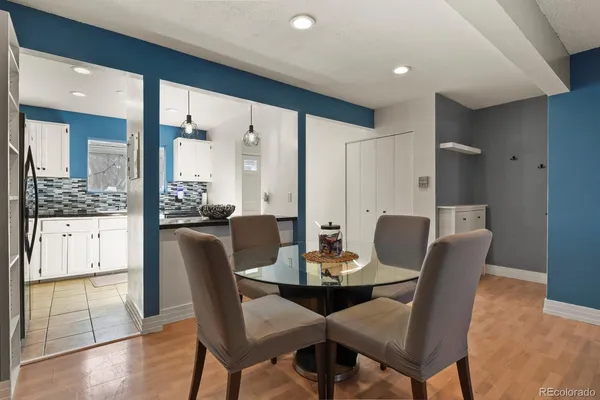 a dining room with furniture and window