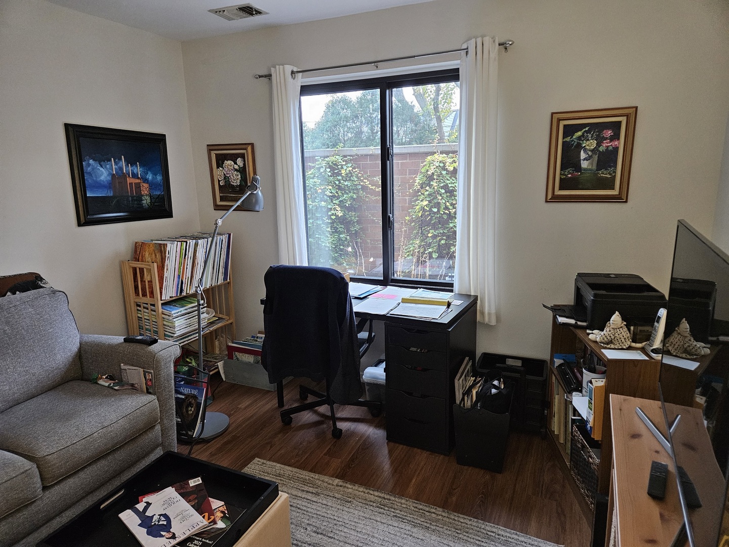2150 Bouterse Street, Unit 106 Park Ridge, IL 60068 - Photo 12 of 25 a view of a livingroom with workspace and a couch