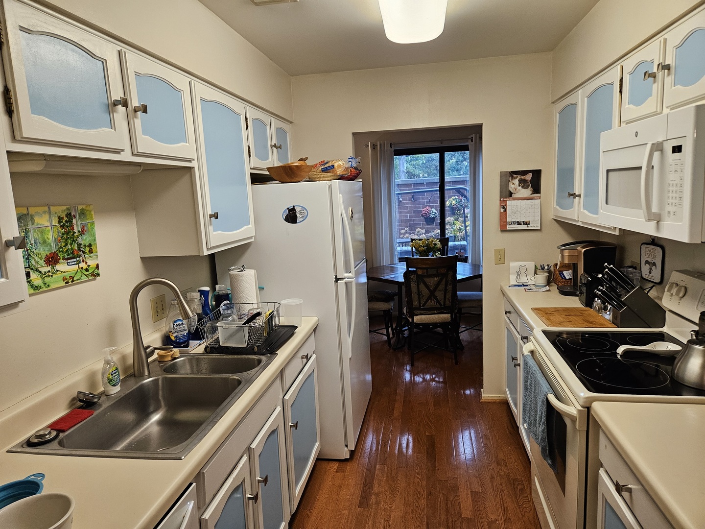 2150 Bouterse Street, Unit 106 Park Ridge, IL 60068 - Photo 9 of 25 a kitchen with a sink stove top oven and cabinets