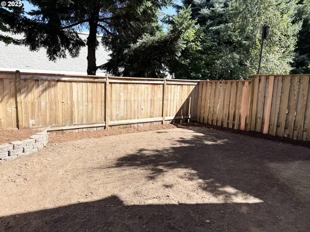 a view of a backyard of a house