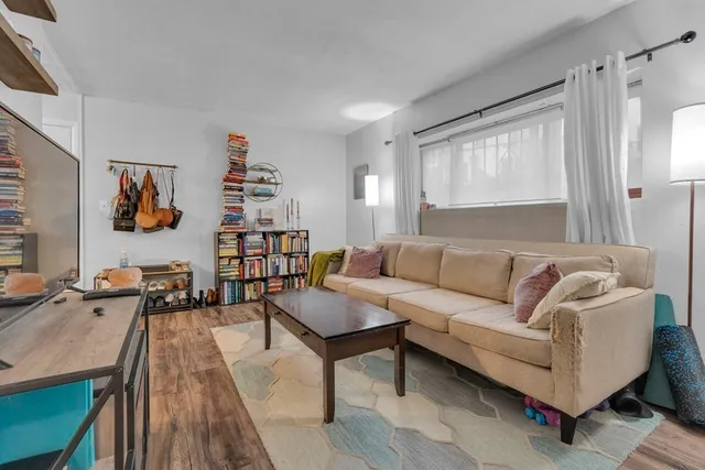 a living room with furniture and a table
