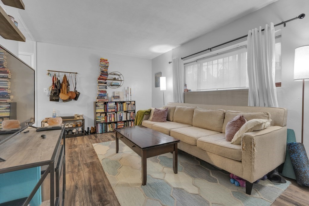 10 Scottfield Road, Unit 2 Boston, MA 02134 - Photo 3 of 10 a living room with furniture and a table