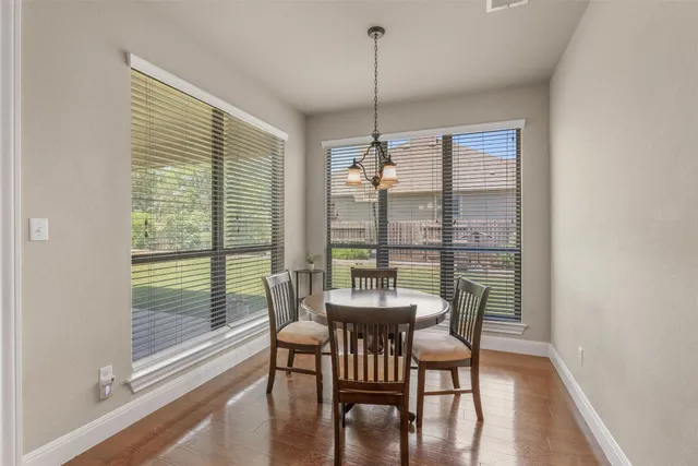 a dining room with furniture window wooden floor