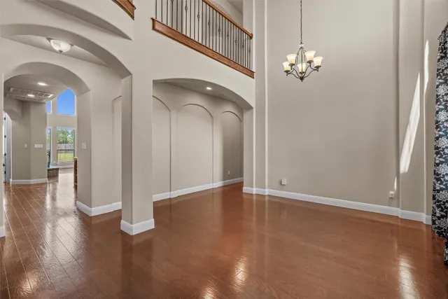 a view of an entryway with wooden floor