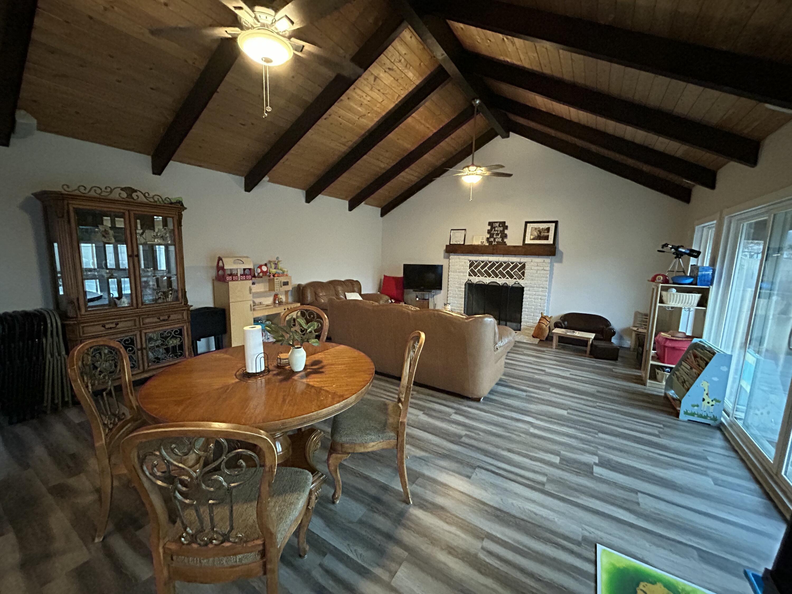 11228 Cameron Drive Riverside, CA 92505 - Photo 11 of 28 a living room with furniture a fireplace and a flat screen tv