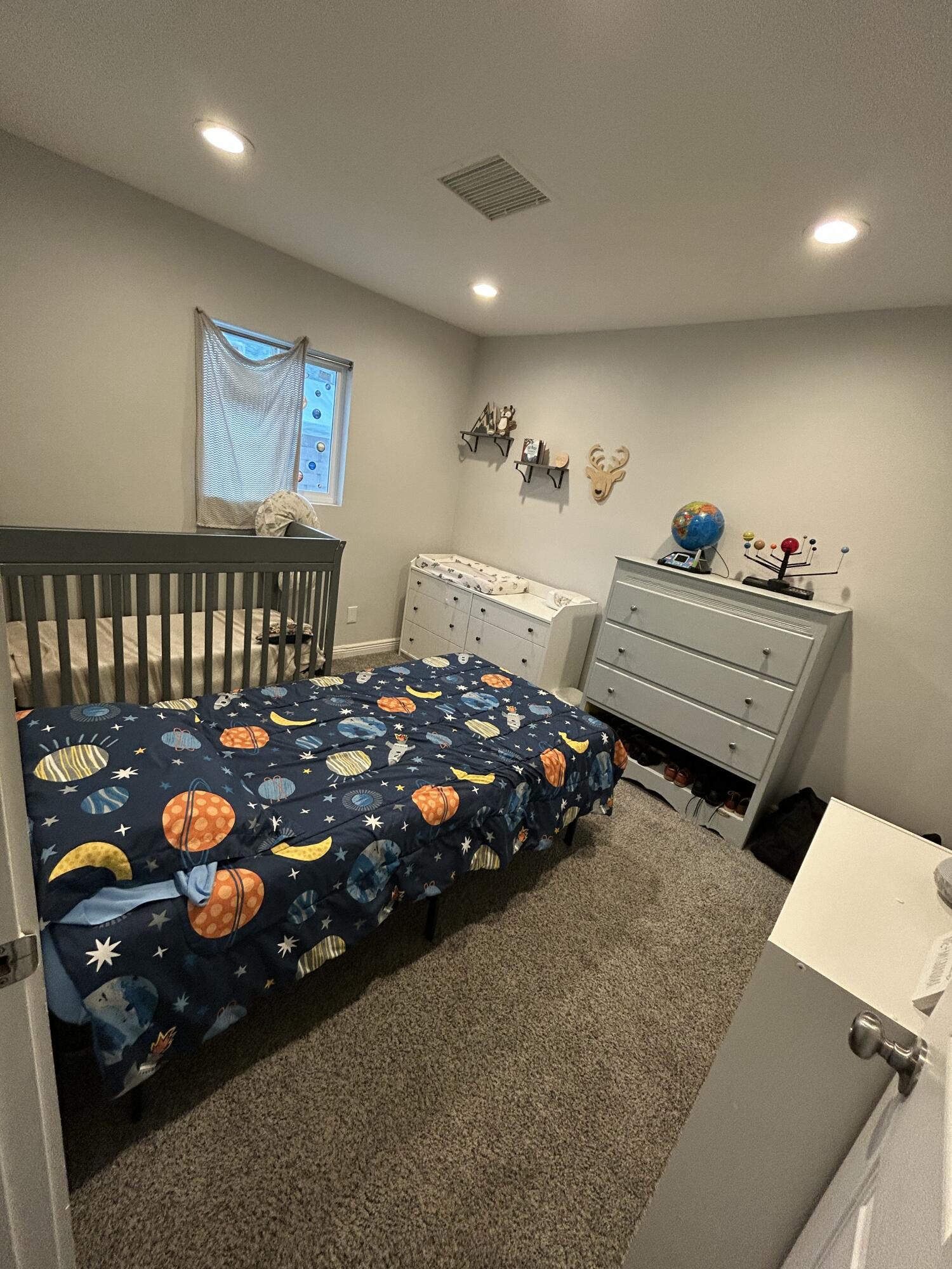 11228 Cameron Drive Riverside, CA 92505 - Photo 15 of 28 a bed room with furniture and a window