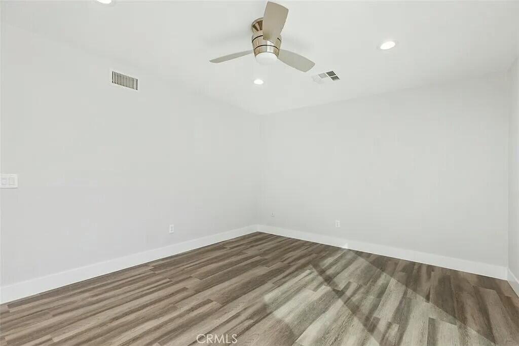 11228 Cameron Drive Riverside, CA 92505 - Photo 16 of 28 a view of a room with wooden floor and fan