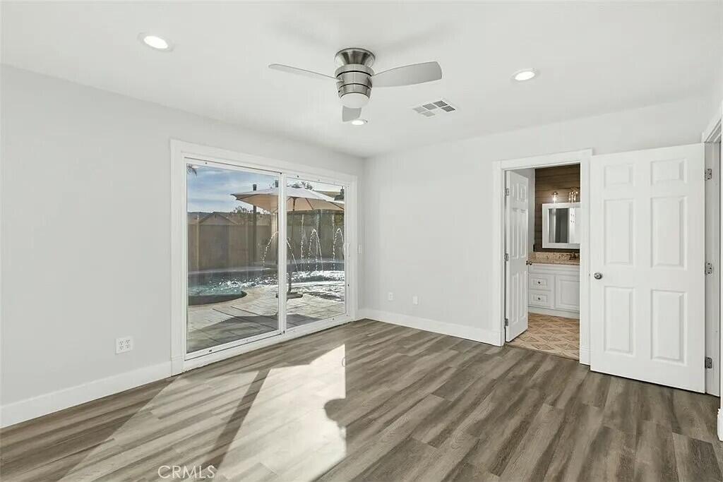 11228 Cameron Drive Riverside, CA 92505 - Photo 17 of 28 wooden floor in an empty room with a window