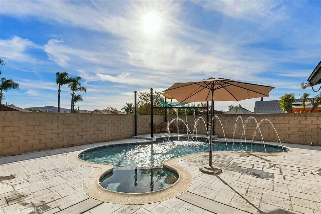 11228 Cameron Drive Riverside, CA 92505 - Photo 21 of 28 a swimming pool with an outdoor seating