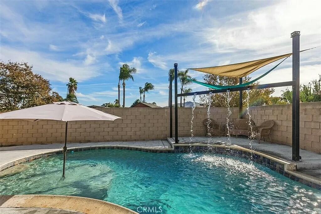 11228 Cameron Drive Riverside, CA 92505 - Photo 23 of 28 a backyard of a house with table and chairs