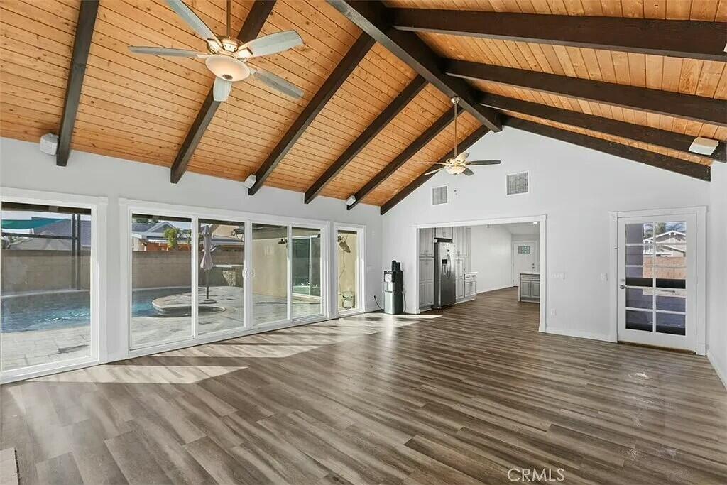 11228 Cameron Drive Riverside, CA 92505 - Photo 10 of 28 a view of an empty room with wooden floor and a window